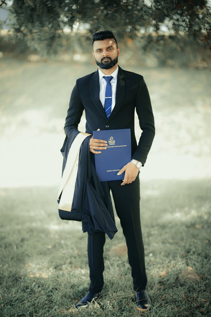 Graduated & Holding Trophy